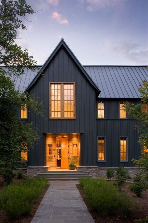 grey house with black metal roof|gray exterior with black trim.